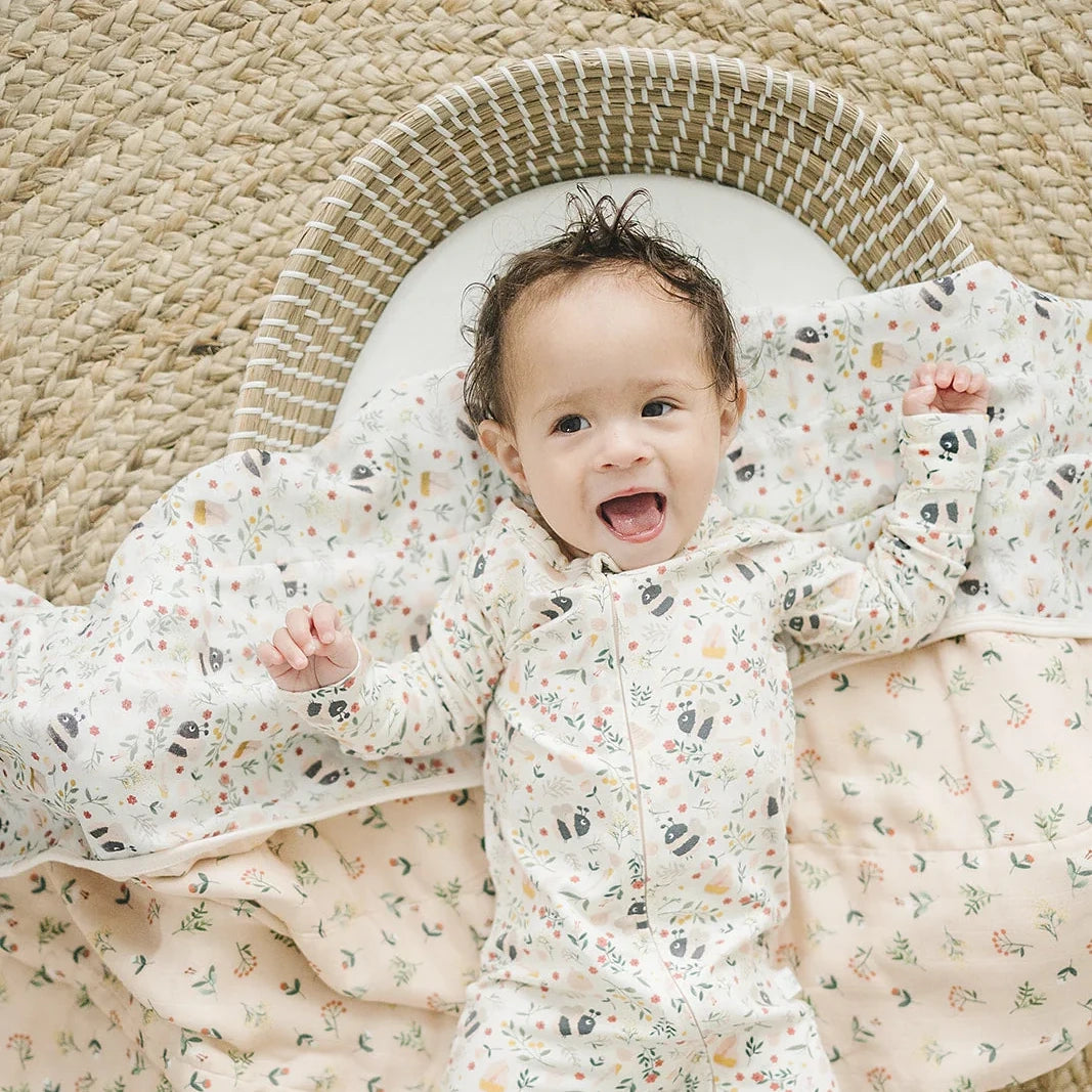 Loulou Lollipop Baby Muslin Quilt in Tanboocel® Bamboo Viscose - Bumble Bees — quilt blanket shown in a nursery setting.