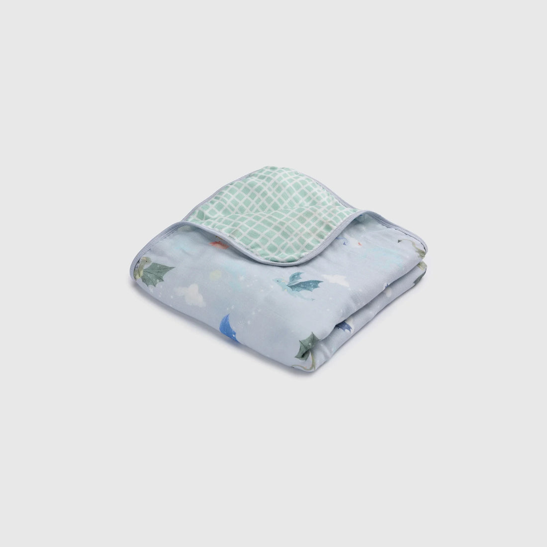 Loulou Lollipop Baby Muslin Quilt in Tanboocel® Bamboo Viscose - Magical Dragons — folded quilt showing the printed front and reverse.