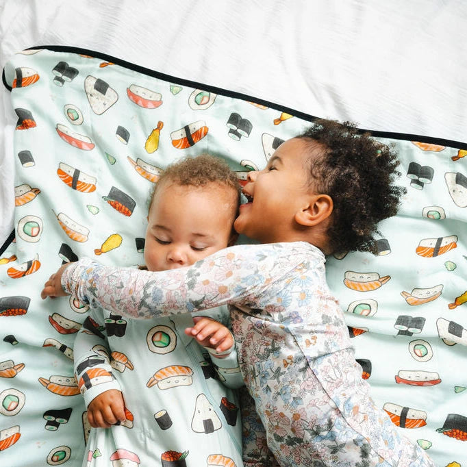 Loulou Lollipop Baby Muslin Quilt in Tanboocel® Bamboo Viscose - Sushi — quilt blanket shown in a nursery setting.