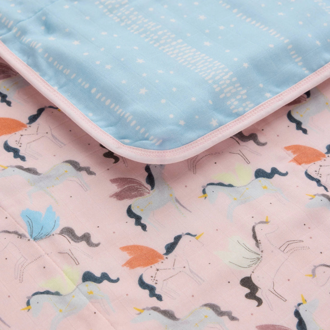 Loulou Lollipop Baby Muslin Quilt in Tanboocel® Bamboo Viscose - Unicorn Ballet — close-up of fabric, print and construction.