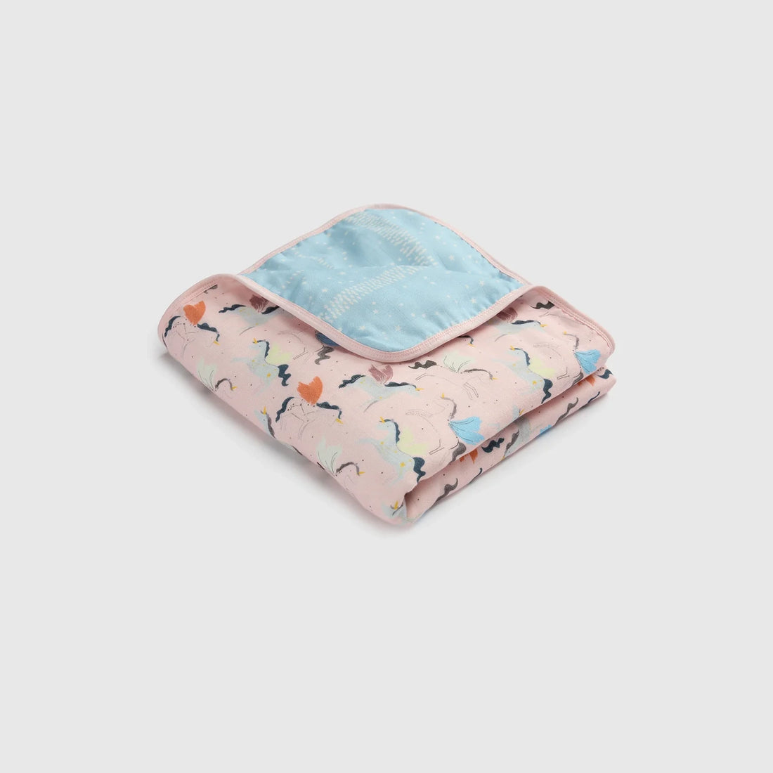Loulou Lollipop Baby Muslin Quilt in Tanboocel® Bamboo Viscose - Unicorn Ballet — folded quilt showing the printed front and reverse.