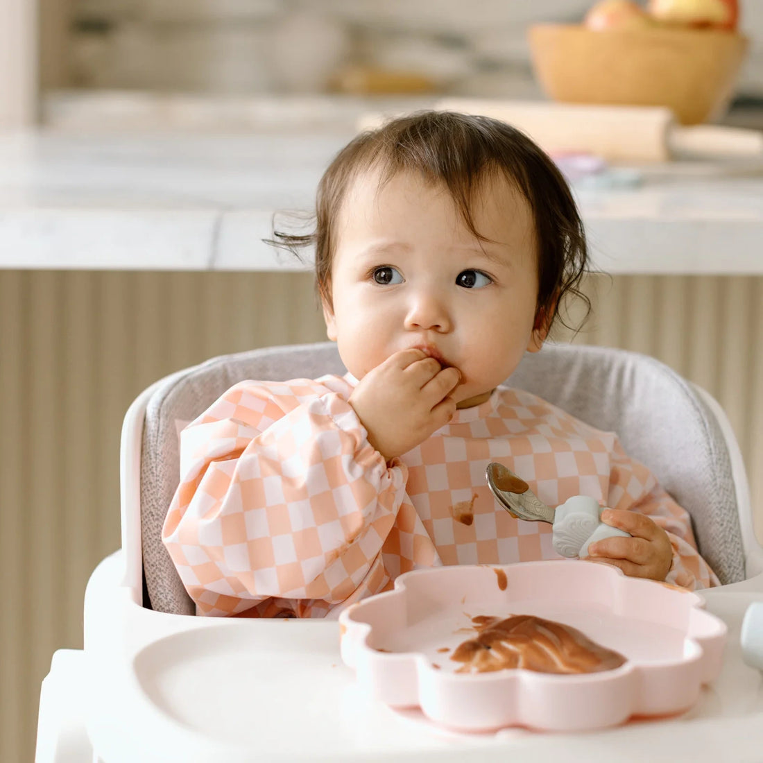 Loulou Lollipop Baby Utensils Set - Skylar Shell — child using the learning utensils at mealtime.