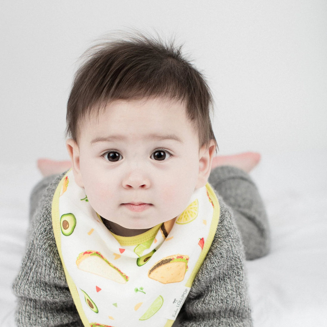 Loulou Lollipop Bandana Bib Set - 2 Pack - Sushi/Taco — baby wearing the bandana bib.