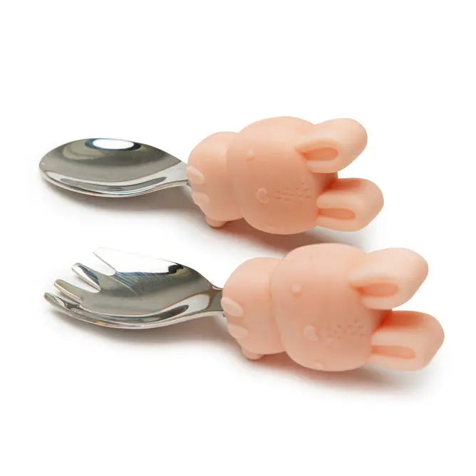 Loulou Lollipop Born To Be Wild Learning Spoon/Fork Set, pink bunny silicone handles gripping shiny stainless utensils.