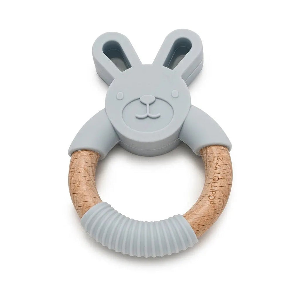 Loulou Lollipop Bunny Silicone and Wood Teether with gray bunny head and natural wood ring being chewed.