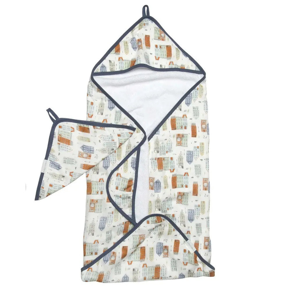 Loulou Lollipop Hooded Towel Set, city-print fabric with navy trim; two-piece baby bath set shown laid flat.