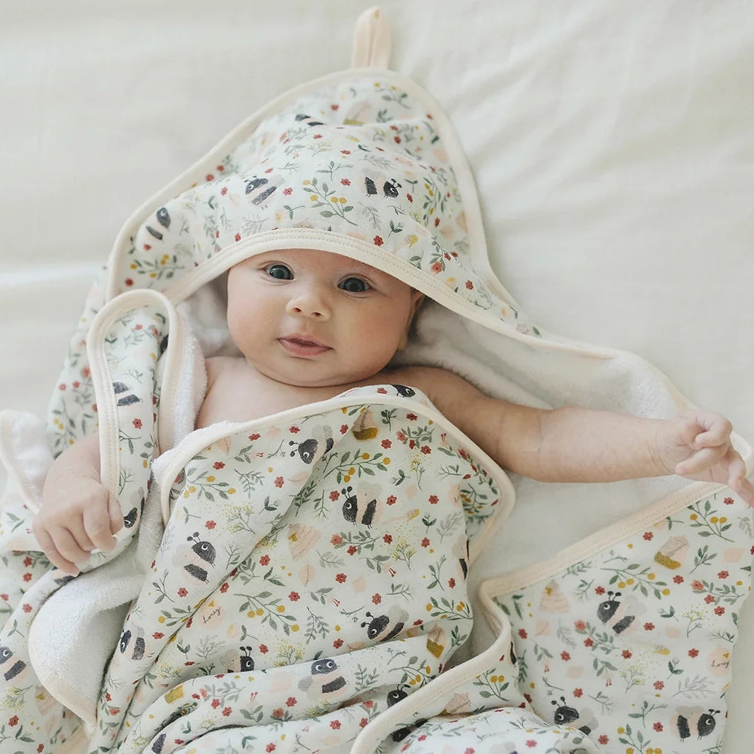 Loulou Lollipop Hooded Towel Set - Bumble Bees — hooded towel shown during baby bath time.