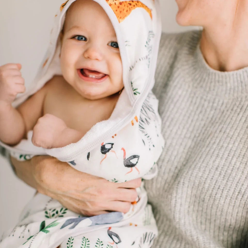 Loulou Lollipop Hooded Towel Set - Safari Jungle — hooded towel shown during baby bath time.