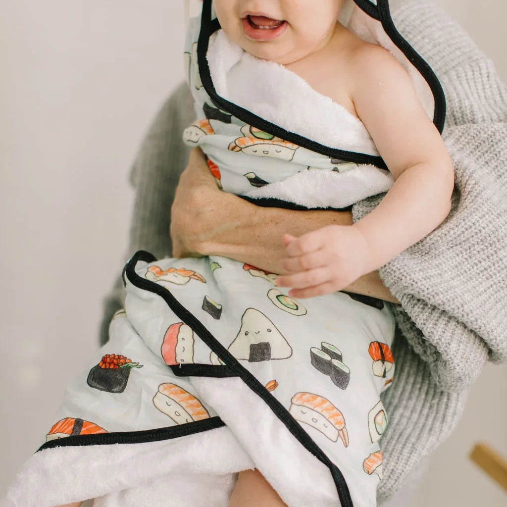 Loulou Lollipop Hooded Towel Set - Sushi — hooded towel shown during baby bath time.