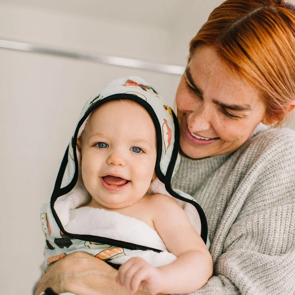 Loulou Lollipop Hooded Towel Set - Sushi — hooded towel shown during baby bath time.