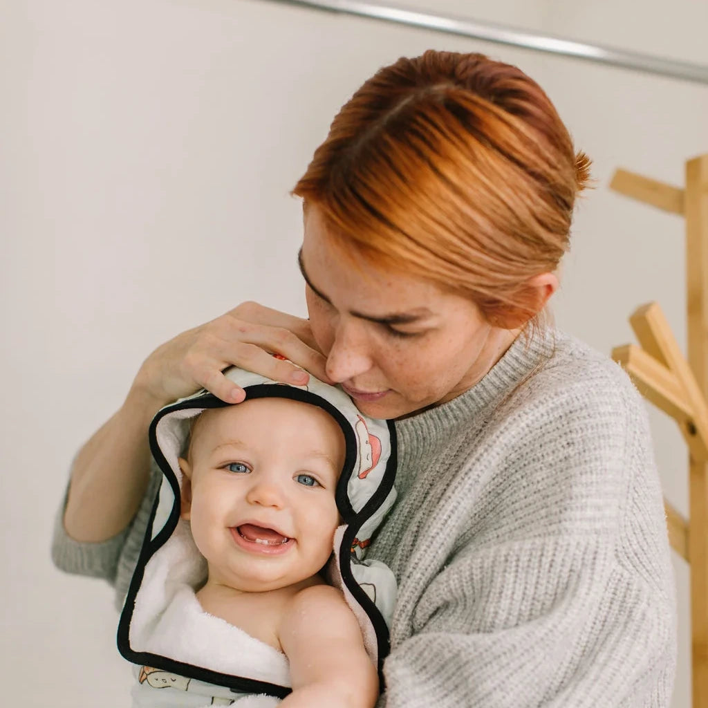 Loulou Lollipop Hooded Towel Set - Sushi — hooded towel shown during baby bath time.