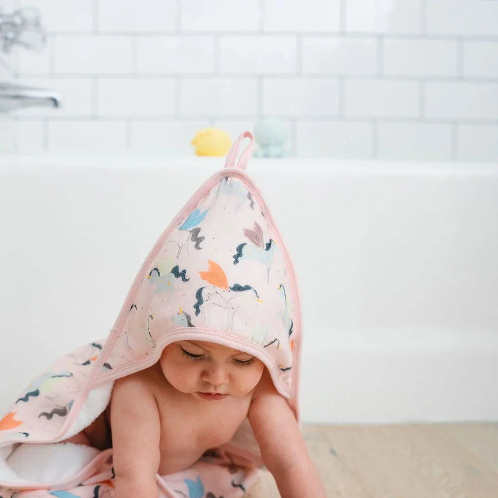 Loulou Lollipop Hooded Towel Set - Unicorn Ballet — hooded towel shown during baby bath time.