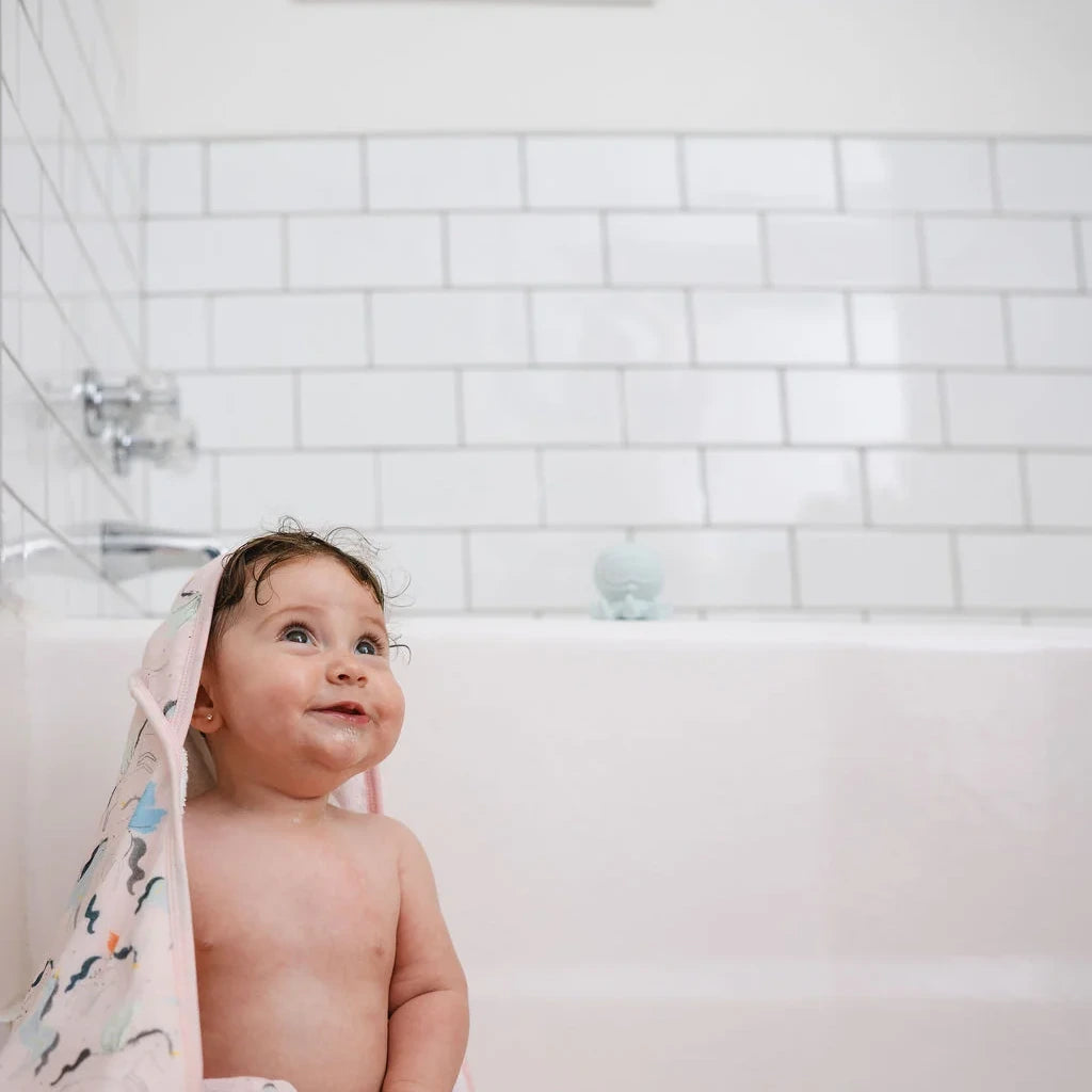 Loulou Lollipop Hooded Towel Set - Unicorn Ballet — hooded towel shown during baby bath time.