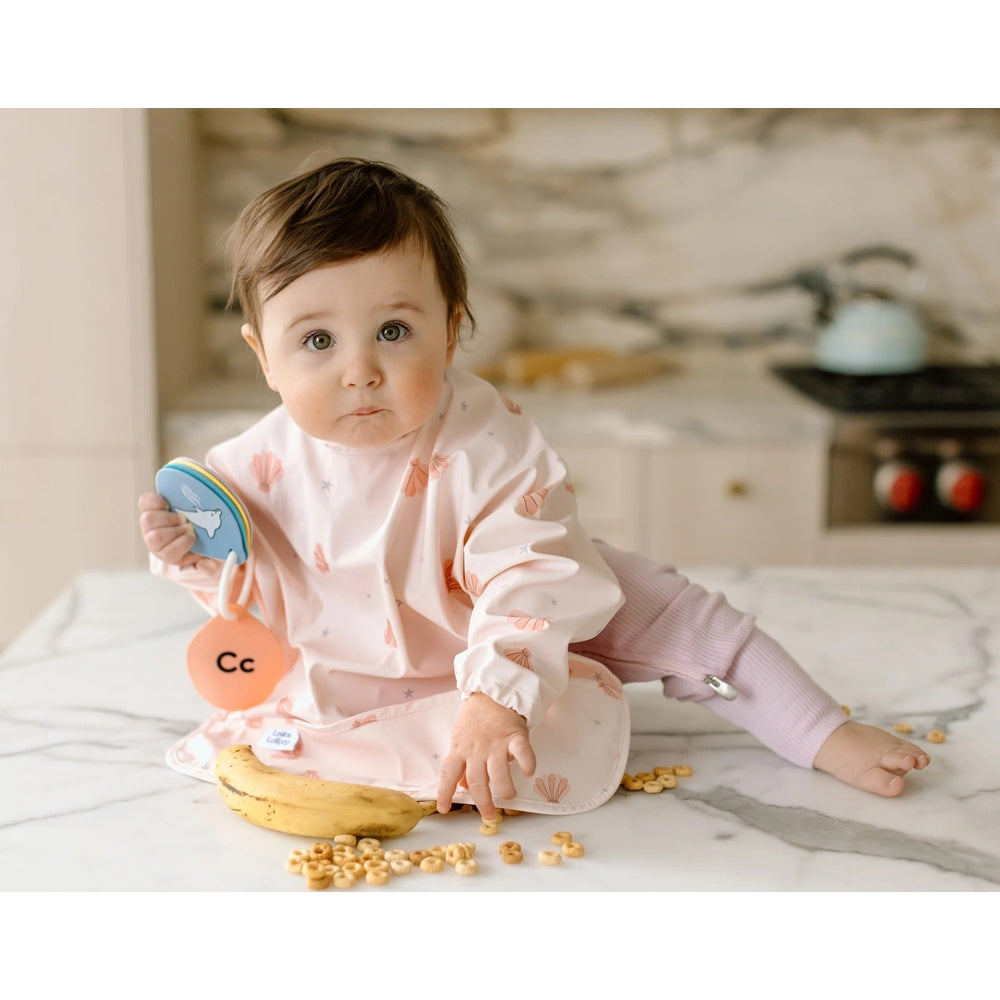 Loulou Lollipop Long Sleeve Bib Seashells in Pale Pink Seashell Print