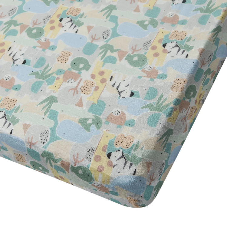 Loulou Lollipop muslin fitted crib sheet in pastel animal puzzle print.