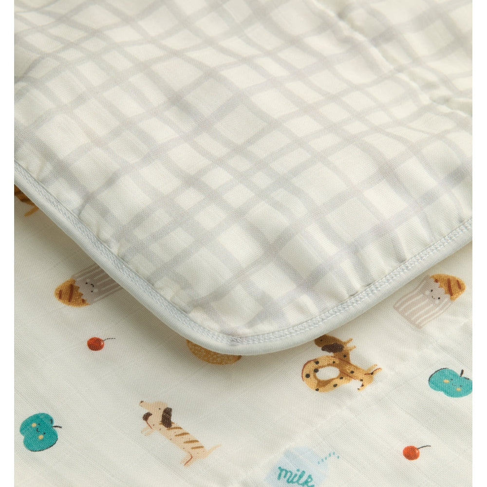 Baby blanket with animal pattern on a plain background