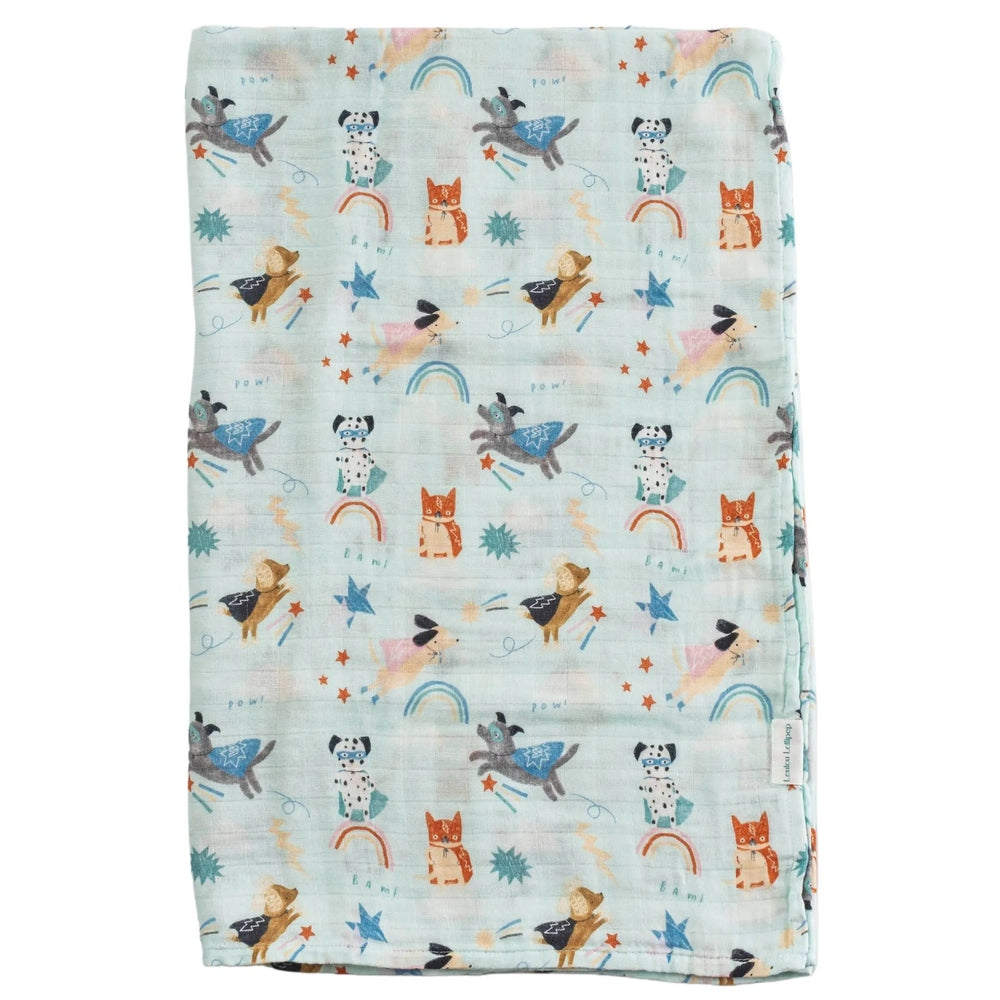 LOULOU LOLLIPOP Muslin Swaddle laid flat in pastel aqua with playful animal print, showcasing breathable cozy fabric.