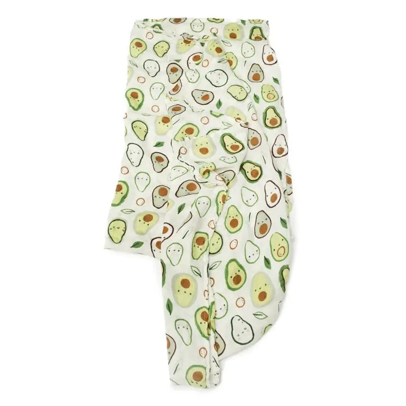 Loulou Lollipop Muslin Swaddle blanket, white with avocado print, softly draped to show breathable fabric.