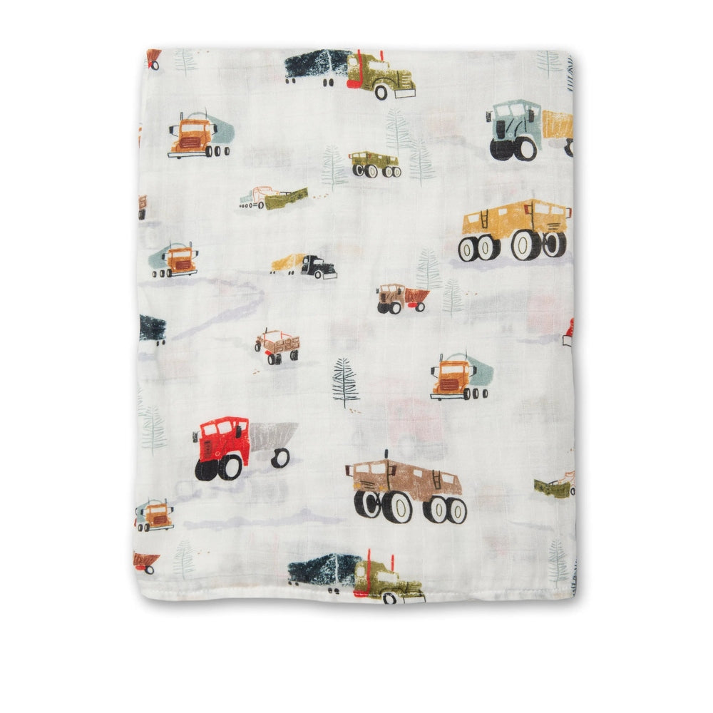 Loulou Lollipop Muslin Swaddle blanket, white with colorful construction trucks, laid flat to show soft, breathable fabric.