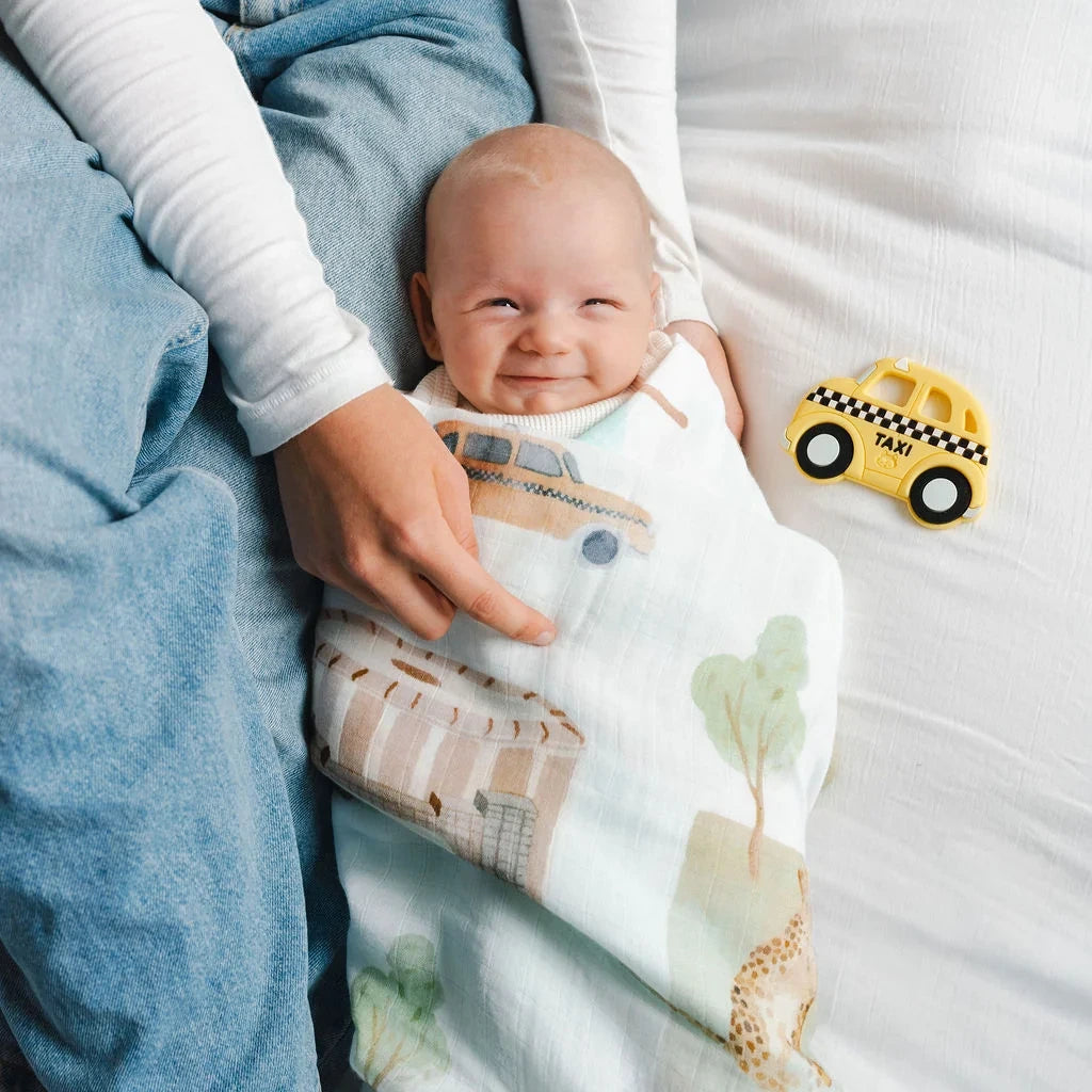 Loulou Lollipop OneC™ Silicone Clip Teether Set - Yellow Taxi — baby holding or using the silicone teether.