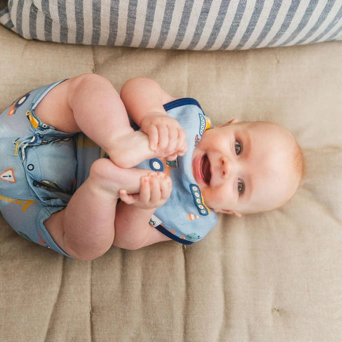 Loulou Lollipop Short Romper - Tiny Engineers — baby wearing the sleep bag at home.