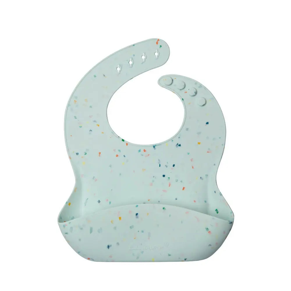 Loulou Lollipop silicone bib with light blue speckle and front pocket catching spills during feeding.