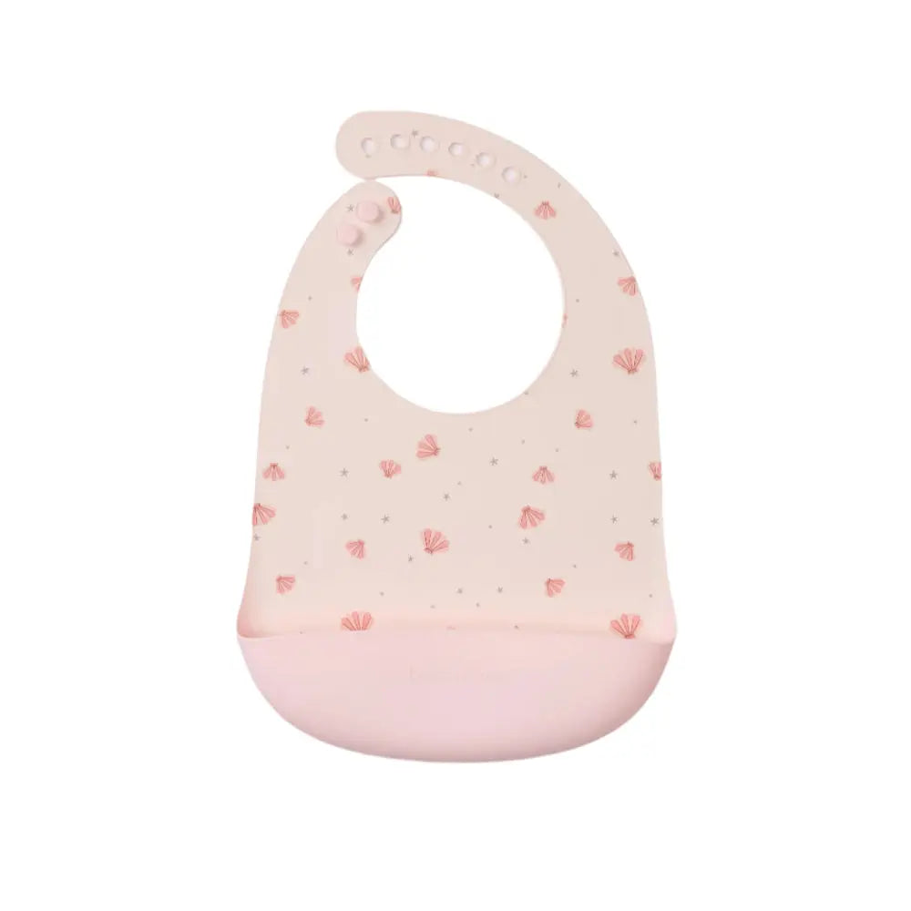 Loulou Lollipop Silicone Bib in soft pink with shell print and front pocket to catch spills.