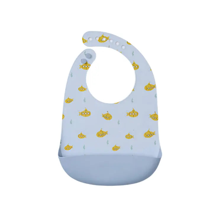 Loulou Lollipop Silicone Bib, light blue with yellow fish print, showing a deep pocket to catch crumbs.