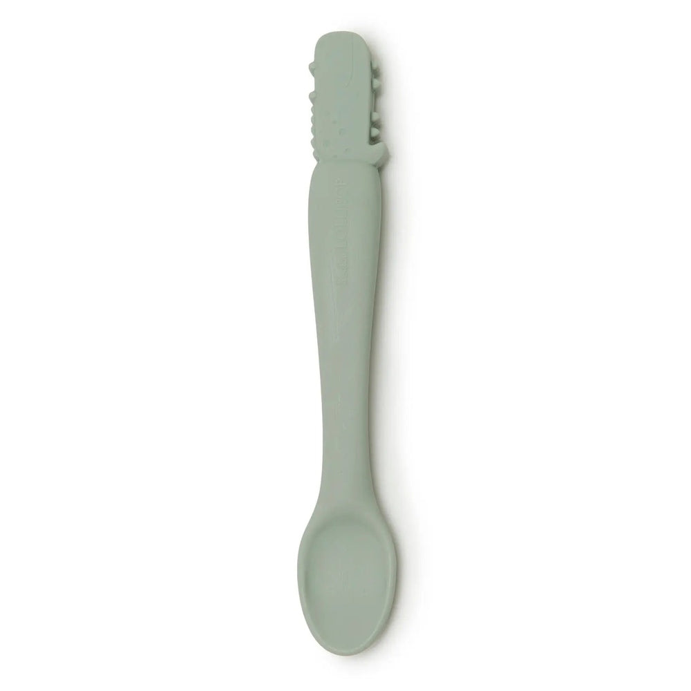 Loulou Lollipop Silicone Feeding Spoon in soft green; gentle rounded head shown for infant feeding.