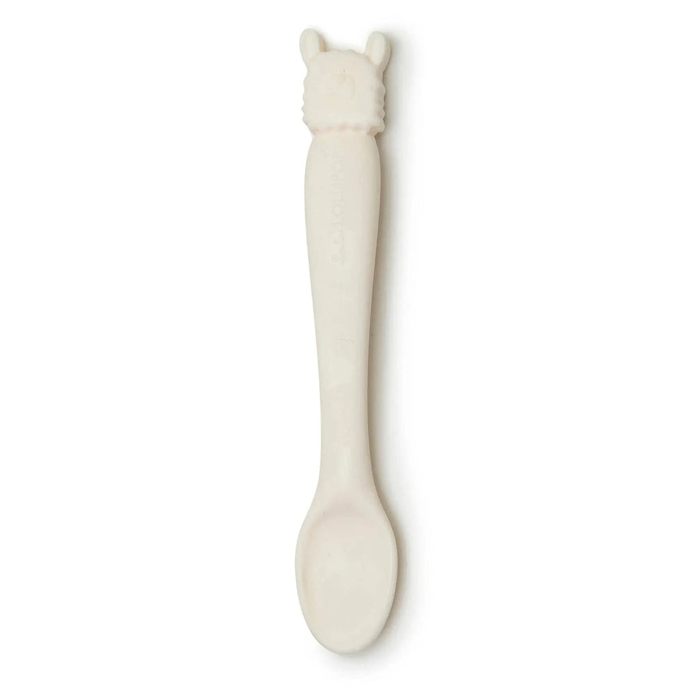 Loulou Lollipop Silicone Feeding Spoon white with llama-top handle, laid flat showing soft silicone for gentle feeding.