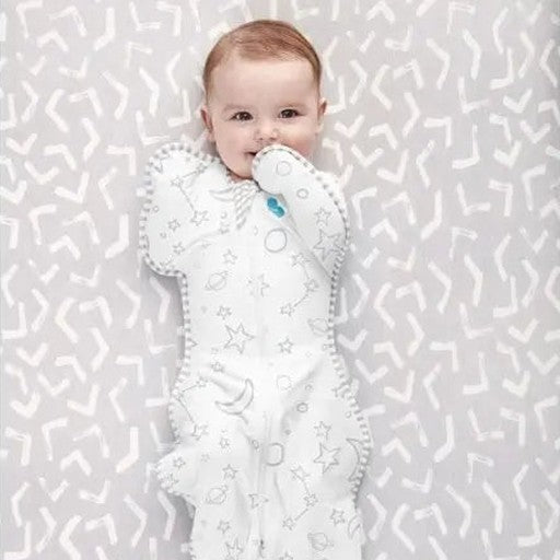 Love To Dream Swaddle Up Bamboo 1.0 Tog Stars & Moon Cream; baby swaddled with arms up in starry cream fabric