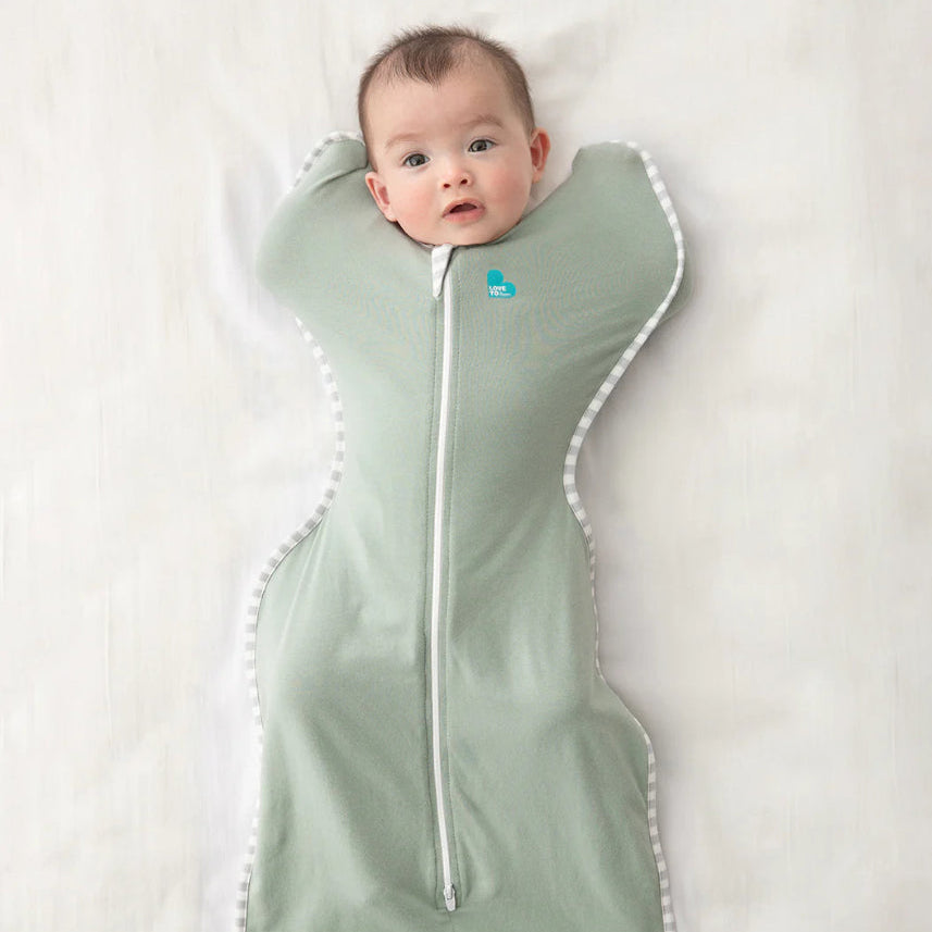 Love To Dream Swaddle Up Cotton 0.2 Tog Olive baby sleep swaddle with white trim and front zipper.