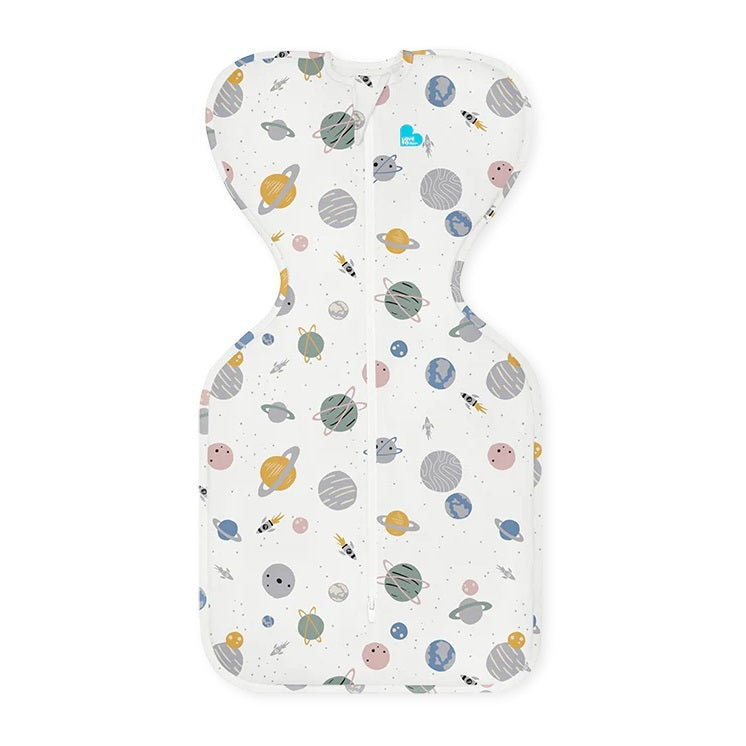 Love To Dream Swaddle Up Cotton 0.2 Tog Rocket White Space swaddle laid flat with space-print fabric and front zipper