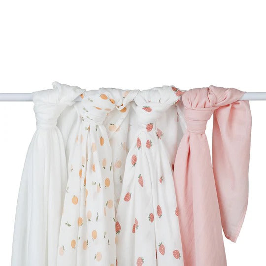 Lulujo bamboo muslin swaddle blankets, 4-pack; white with orange prints and solid pink blanket on rod