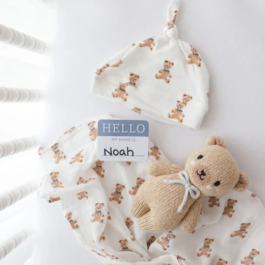 Lulujo baby hat and swaddle set in white vintage bear print with knit teddy plush accessory