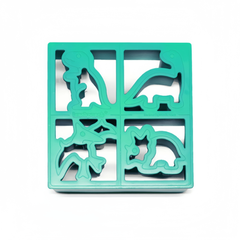 Lunch Punch Dino Four sandwich cutter set in turquoise, four dinosaur-shaped cutters arranged in a square frame