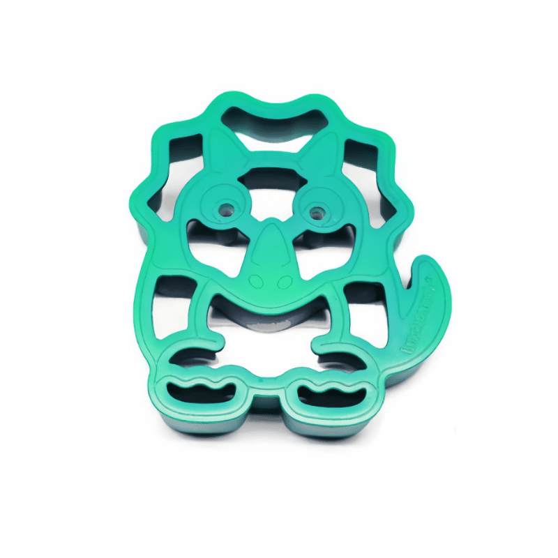 Lunch Punch Sandwich Cutter Dino Single turquoise plastic, pressed over a sandwich to form dinosaur shapes.