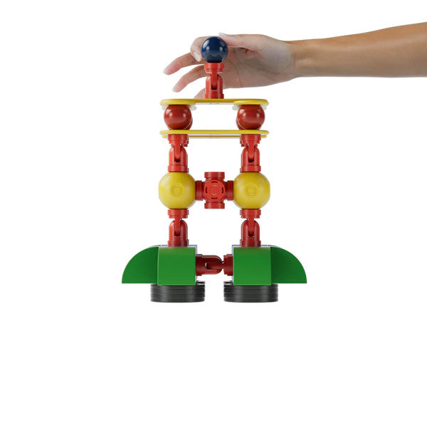 Magfun magnetic toy set tower building with red, yellow, green pieces; hand assembling

