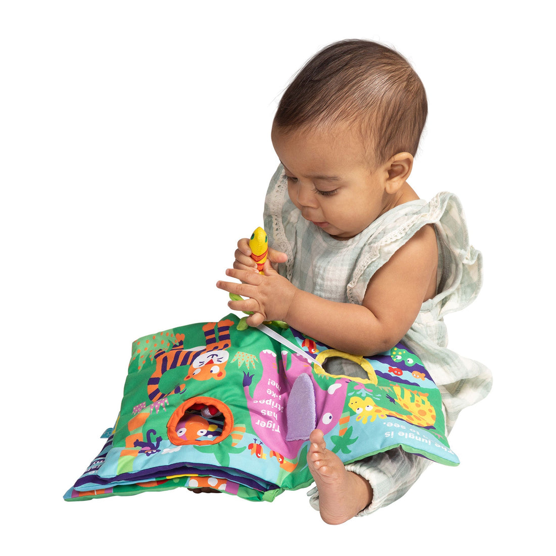 Manhattan Toy Buzzing Through Soft Book - baby holding the open soft book