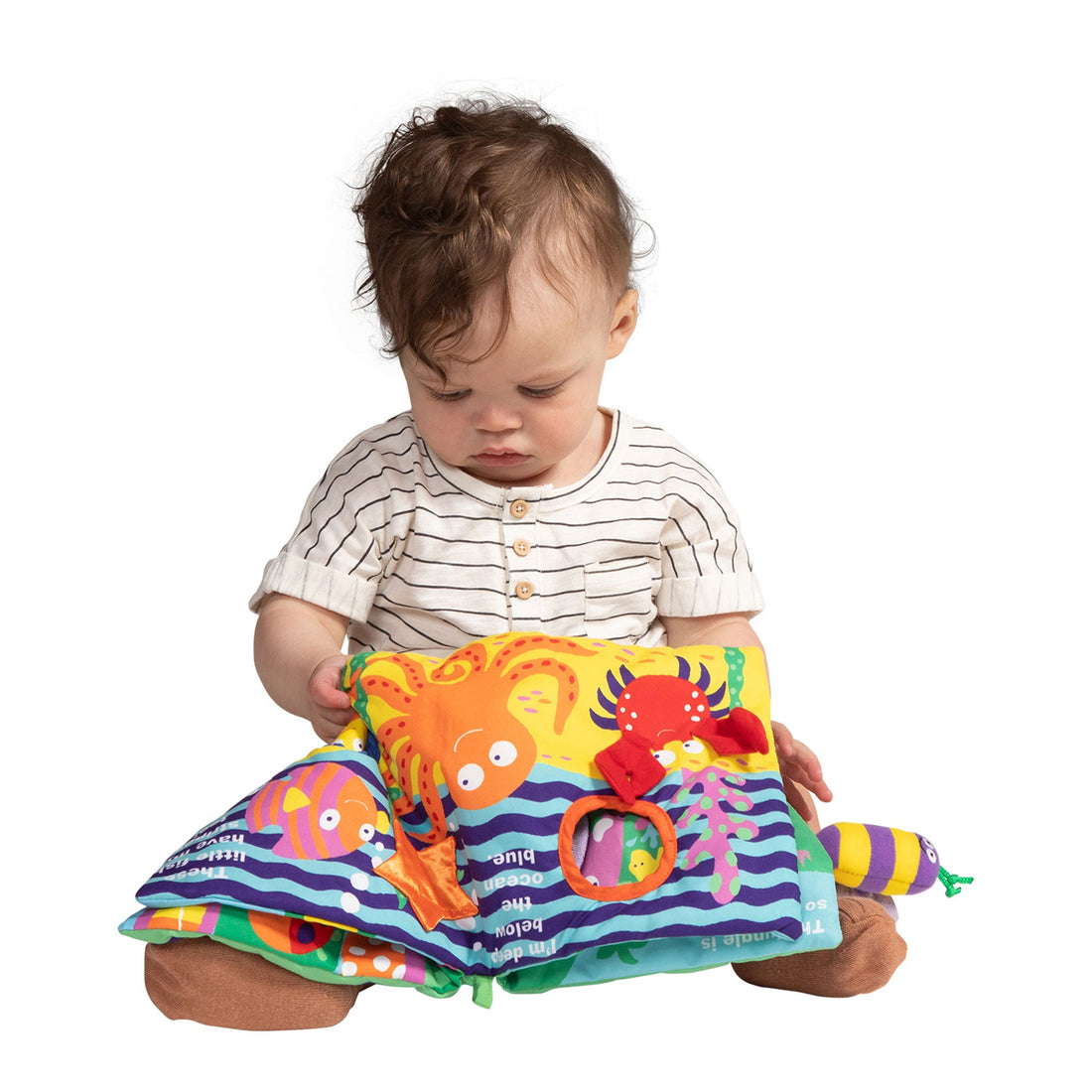 Manhattan Toy Buzzing Through Soft Book - toddler exploring the open fabric pages