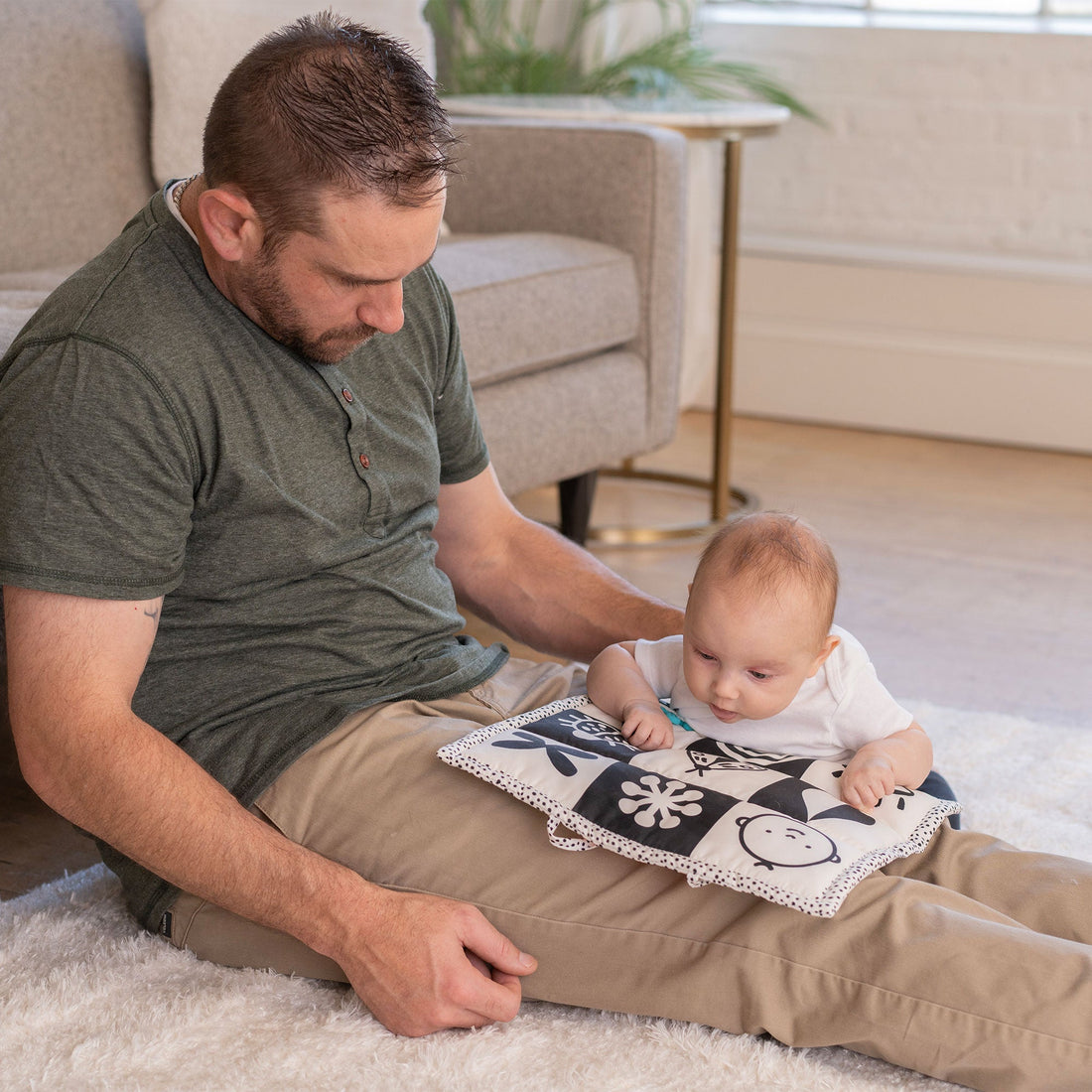 Manhattan Toy Wimmer 3-in-1 Play Mat - parent supporting baby over the flat mat