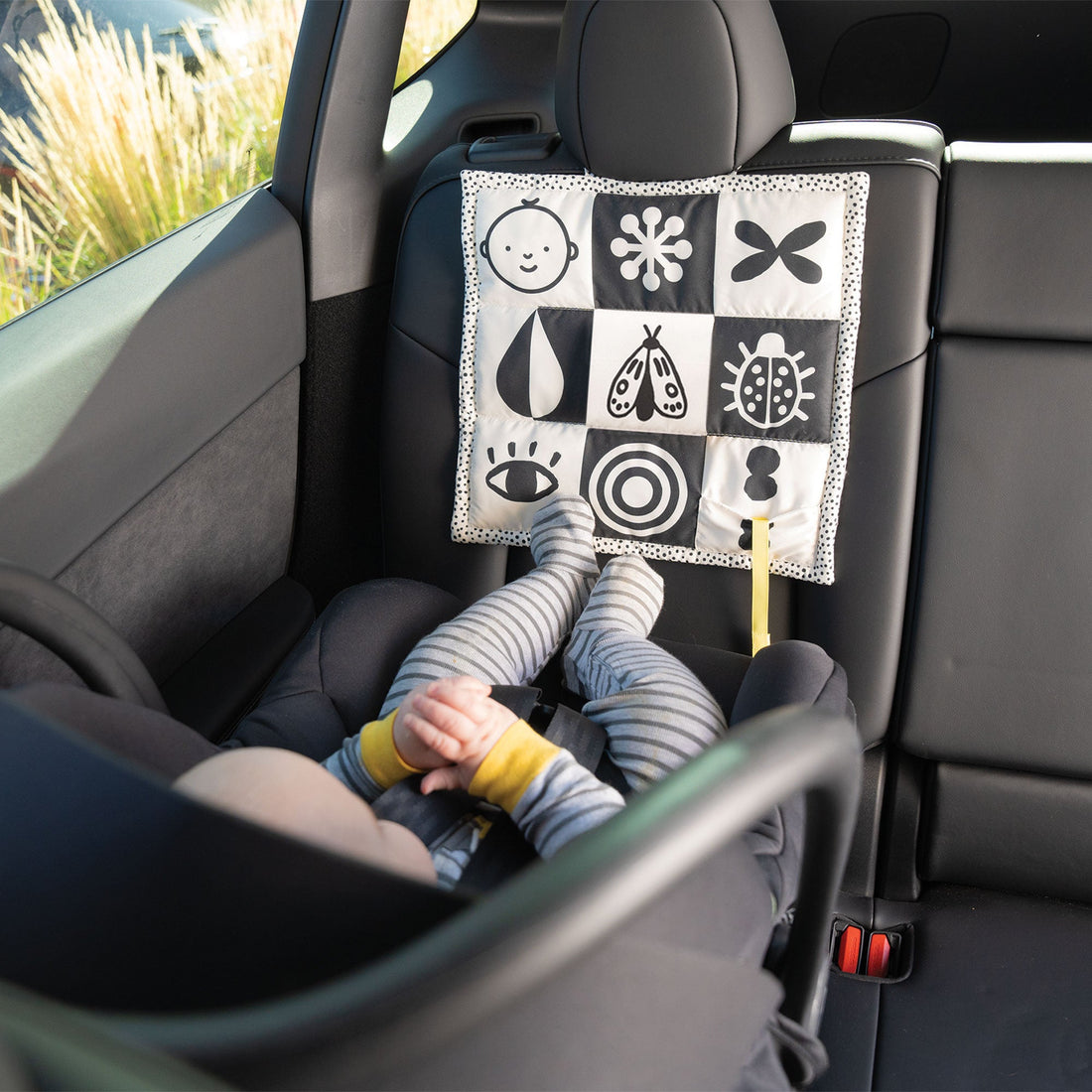Manhattan Toy Wimmer 3-in-1 Play Mat - black-and-white mat tied to a car headrest
