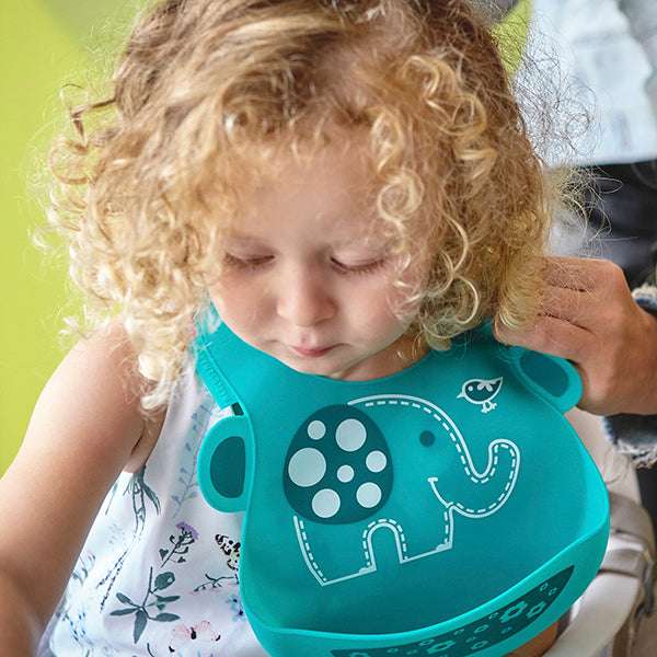 Marcus & Marcus baby bib in teal with an elephant design for mealtime