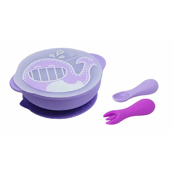 Marcus & Marcus Toddler First Self-Feeding Set; lavender suction bowl with purple silicone spoon and fork, shown ready for self-feeding.