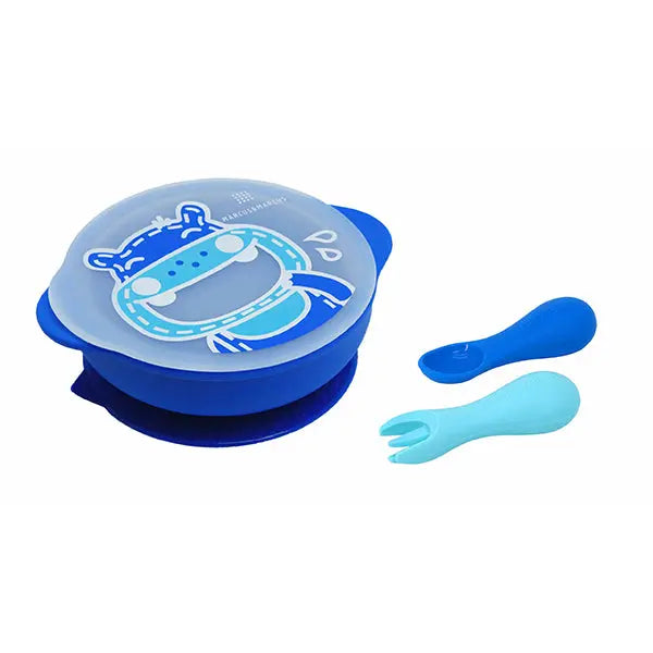 Marcus & Marcus Toddler First Self-Feeding Set featuring blue suction plate stuck to table and silicone spoon and fork