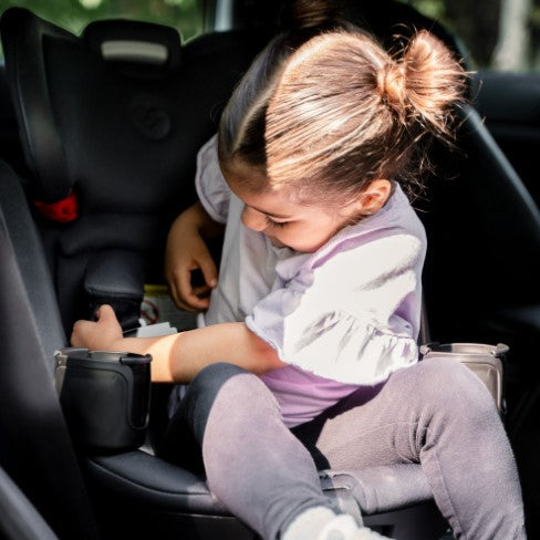 MAXI COSI Andi 360 rotating convertible car seat in black/gray installed in car with child seated.