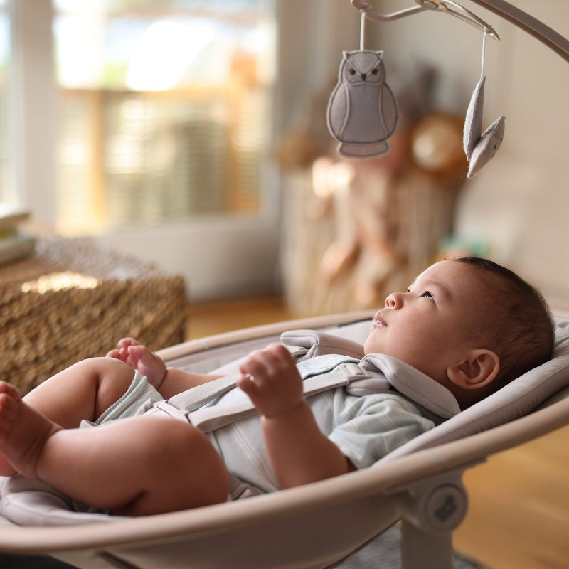 Maxi Cosi Cassia Swing baby swing with soft gray fabric and hanging owl toys