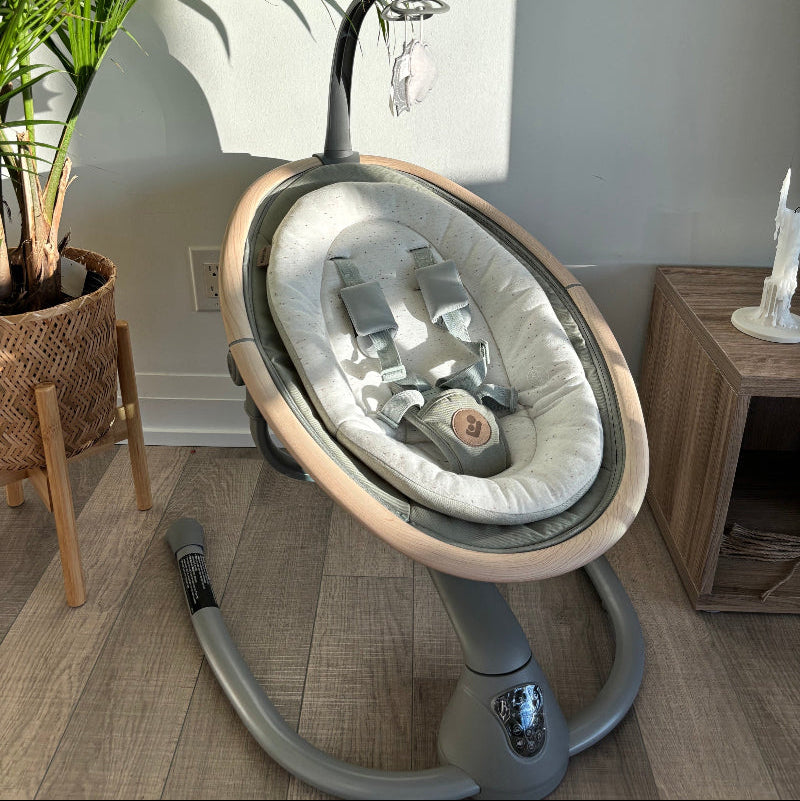 Maxi Cosi Cassia Swing in gray plush seat with circular frame and stand