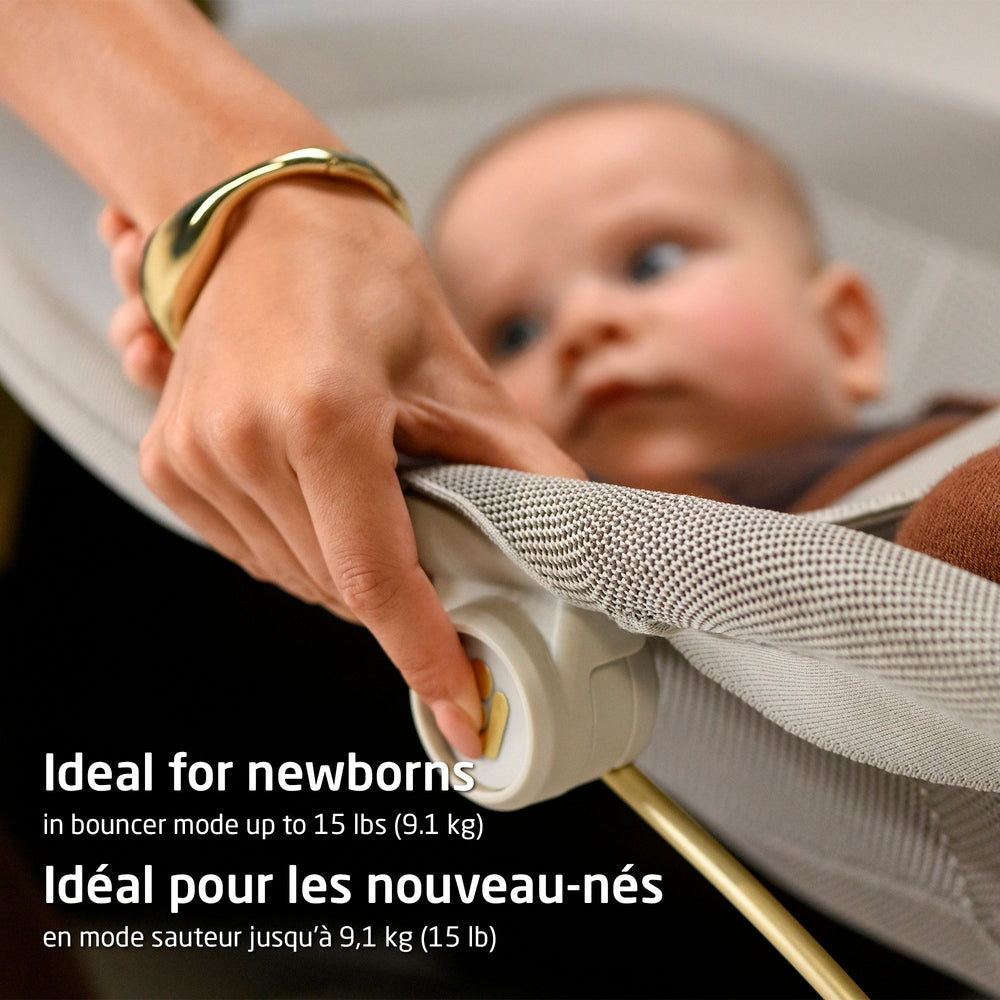 Light gray mesh baby bouncer with baby and side adjustment knob