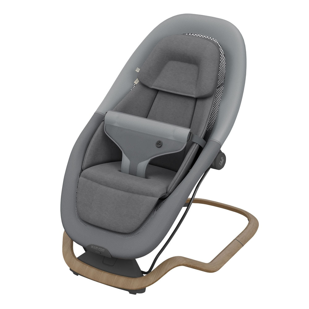 Gray baby bouncer on white background with padded seat and wood-look base